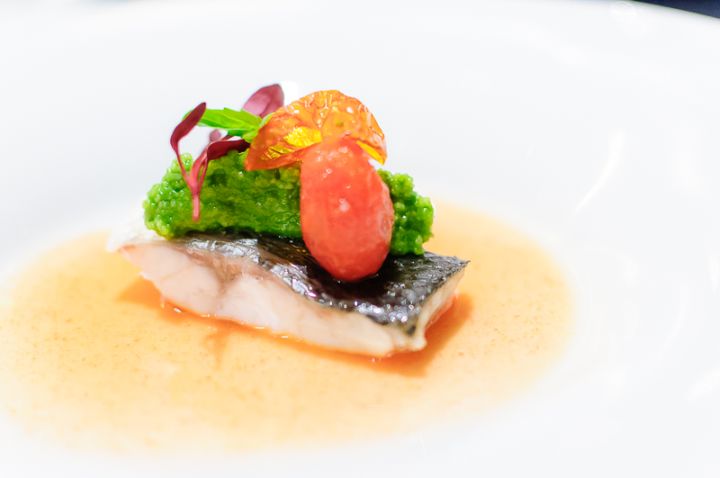 Steamed seabass fillet with basil couscous and tomato juice